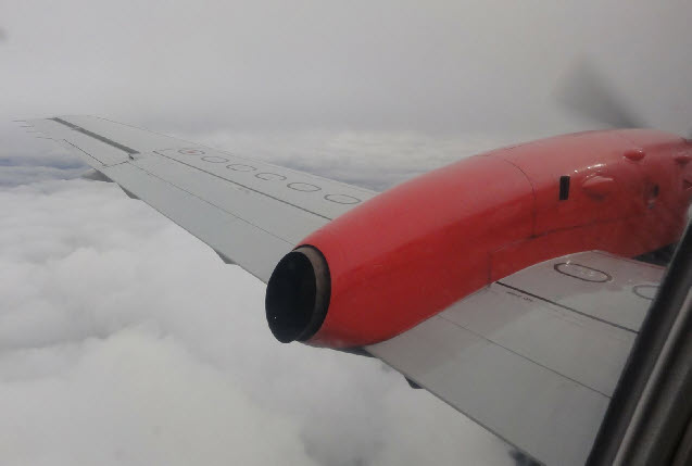 Loganair plane above the clouds 