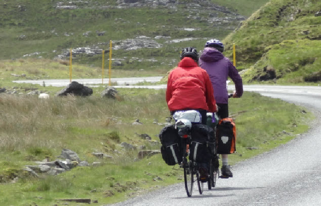 Tourists cycling through the Western Isles 