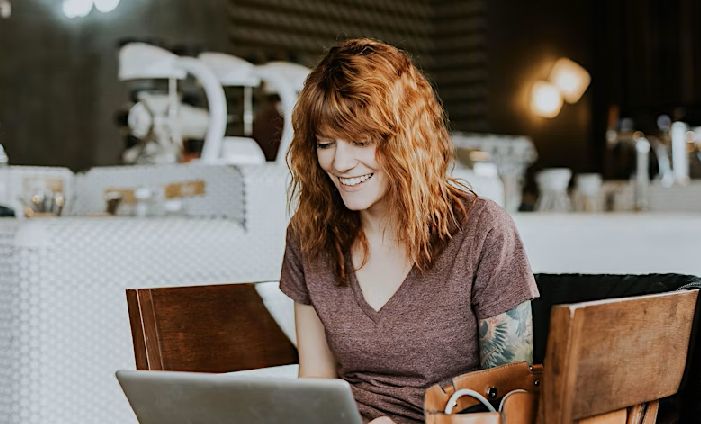 Woman typing on a laptop