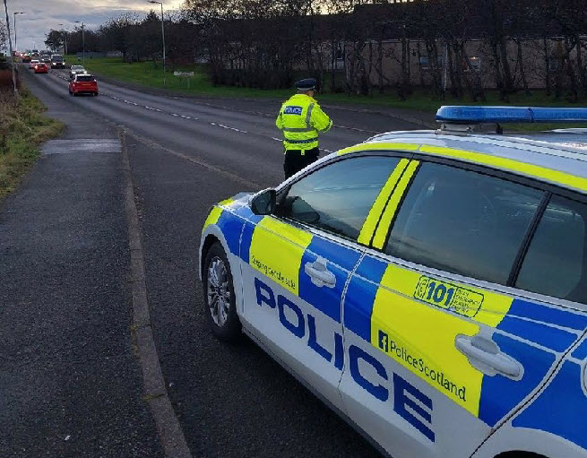 Police officers conduct speed checks